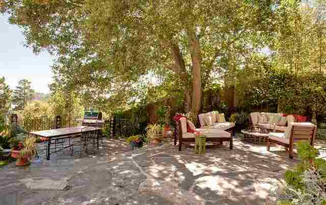Flagstone patio under a heritage oak