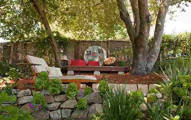 Stone-walled garden with shaded reading nook