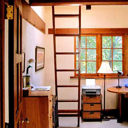Compact study with handcrafted wood ladder to a sleeping loft