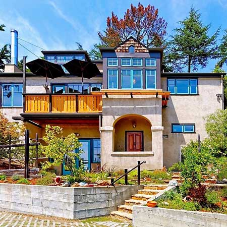 Robinson Drive residence — multi-level stucco home with cedar balcony and terraced garden